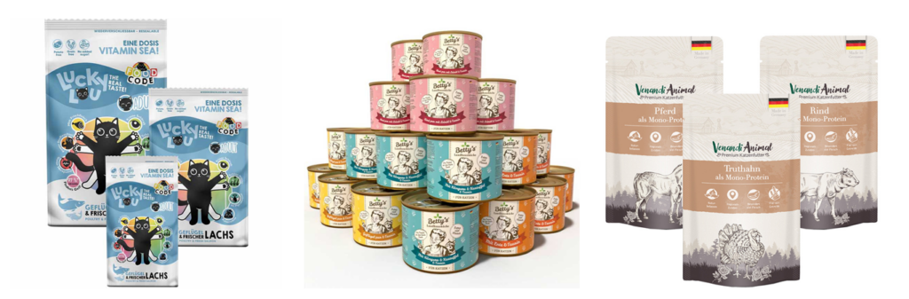 Das Bild zeigt von links nach rechts Lucky Lou Trockenfutter, Nassfutter in Dosen von Bettys Landhausküche und Nassfutter in Pouches von Venandi.